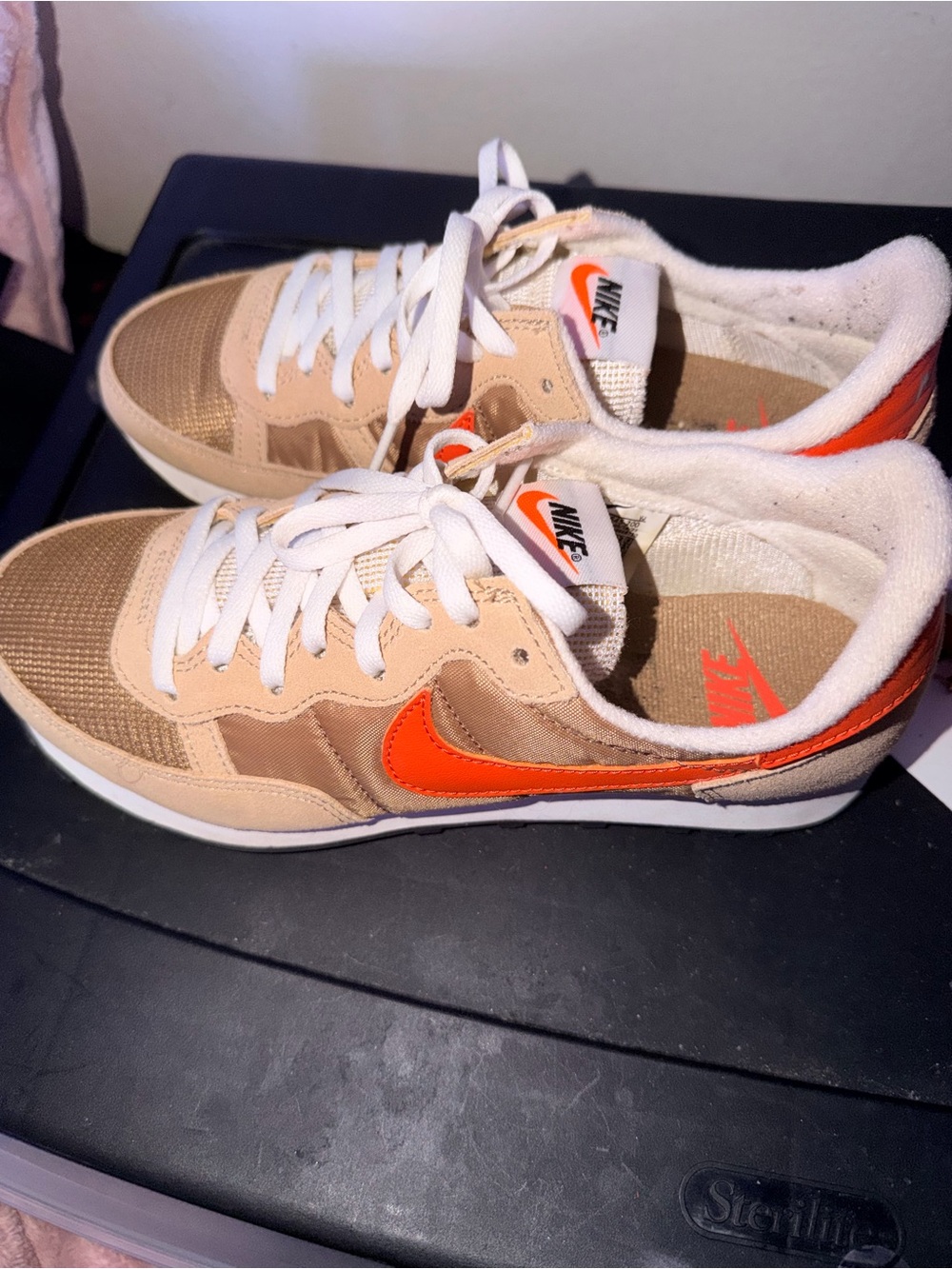 Nike Beige Sneakers with Orange Swoosh and White Laces